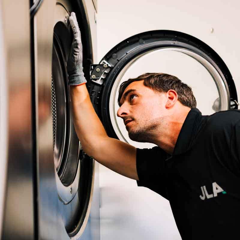 JLA engineer repairing machine