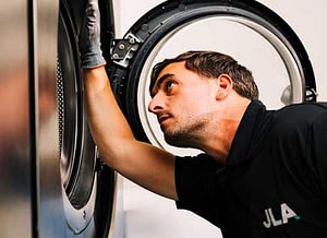 Engineer fixing washing machine