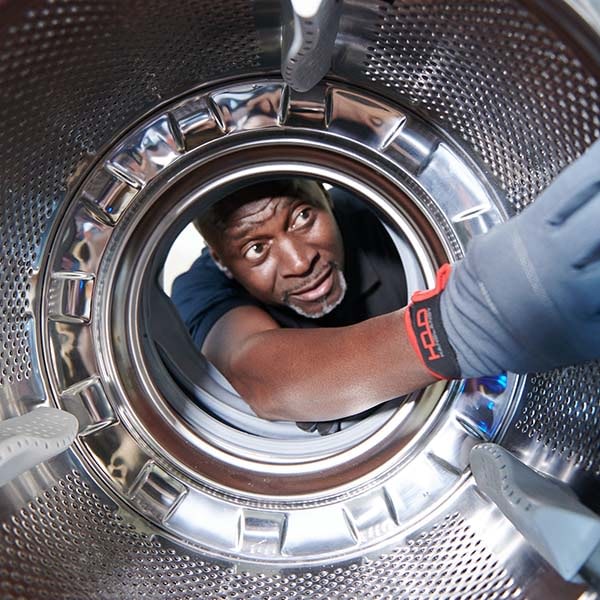 JLA Laundry engineer fixing washing machines