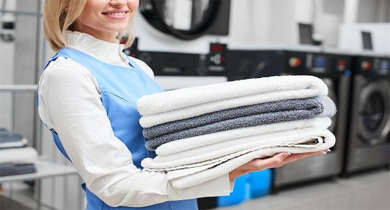 Clean towels in a commercial laundry room
