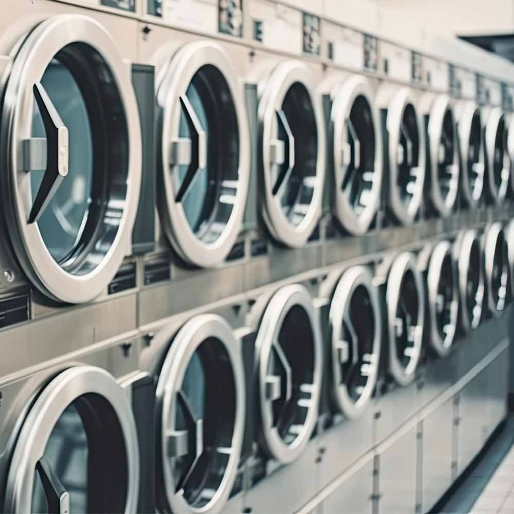 Stacked commercial washing machines